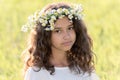 teenage girl with wreath from field Camomile on her head Royalty Free Stock Photo