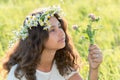 teenage girl with wreath from field Camomile on her head Royalty Free Stock Photo