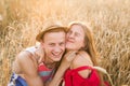 Teenage girlfriend and boyfriend having fun outdoors, kissing, hugging, love concept.