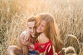 Teenage girlfriend and boyfriend having fun outdoors, kissing, hugging, love concept.