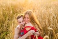 Teenage girlfriend and boyfriend having fun outdoors, kissing, hugging, love concept.