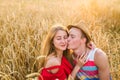 Teenage girlfriend and boyfriend having fun outdoors, kissing, hugging, love concept.