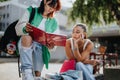 Teenage Girls Collaborating on a School Project in the Urban City Royalty Free Stock Photo