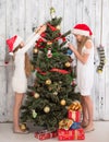 Teenage girls decorating New Year tree at home Royalty Free Stock Photo
