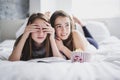 Teenage girls eating popcorn and watching horror movie on tv at home Royalty Free Stock Photo