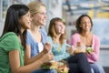 Teenage girls enjoying healthy lunches together Royalty Free Stock Photo