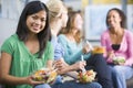 Teenage girls enjoying healthy lunches together Royalty Free Stock Photo