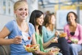 Teenage girls enjoying healthy lunches together Royalty Free Stock Photo