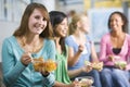 Teenage girls enjoying healthy lunches together Royalty Free Stock Photo