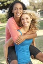 Teenage Girls Having Fun In Park