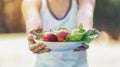 Teenage girls holding a plate with fruits, vegetables, eat healthy