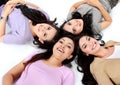 Teenage girls lying on white floor Royalty Free Stock Photo