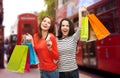 Teenage girls with shopping bags and credit card Royalty Free Stock Photo