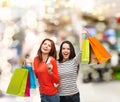 Teenage girls with shopping bags and credit card Royalty Free Stock Photo