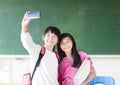 teenage girls student make selfie on the phone.