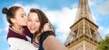 Teenage girls taking selfie over eiffel tower Royalty Free Stock Photo