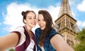 Teenage girls taking selfie over eiffel tower Royalty Free Stock Photo