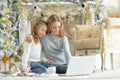 Portrait of teenage girls using laptop while sitting Royalty Free Stock Photo