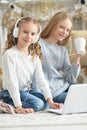 Portrait of cute teenage girls using laptop Royalty Free Stock Photo