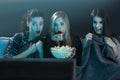 Scared teenage watching movies Royalty Free Stock Photo