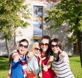 Teenage girls or young women showing thumbs up Royalty Free Stock Photo