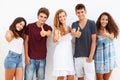 Teenage Group Leaning Against Wall Giving Thumbs Up Royalty Free Stock Photo