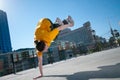 Teenage hip-hop girl dancing over city landscape Royalty Free Stock Photo