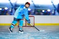 Teenage hockey player during practice at ice arena Royalty Free Stock Photo