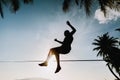 Teenage jumping on slackline