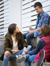 Teenage males and girl talking Royalty Free Stock Photo