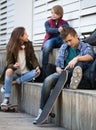 Teenage males and girl talking Royalty Free Stock Photo