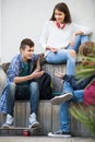 Teenage males and girl talking Royalty Free Stock Photo
