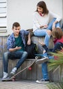 teenage males and girl talking Royalty Free Stock Photo