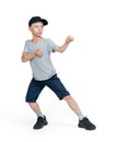 A teenage man in shorts, T-shirt, cap stands in a karate pose, isolated on a white background.