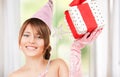 Teenage party girl with magic wand and gift box Royalty Free Stock Photo