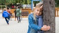 Teenage playing hide-and-go-seek in the playground