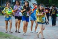 Teenage plays water with his friends during Songkran