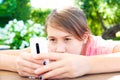 Teenage problems. Young girl addicted to social media technologies.