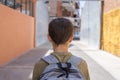 Teenage school boy with a backpack on his back walking to school Royalty Free Stock Photo