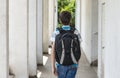 Teenage school boy with a backpack on his back walking to school Royalty Free Stock Photo