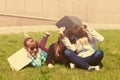 Teenage school girls lying on a grass in campus Royalty Free Stock Photo