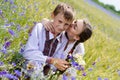 Teenage sister and little brother together on summer wheat fields Royalty Free Stock Photo