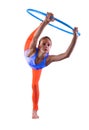 Teenage sportive girl is doing exercises with hula hoop t on grey background. Having fun playing game . Sport healthy lifestyle co