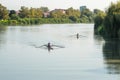 Teenage sportsmen in a boat, rowing on the river Rioni, Poti, Ge