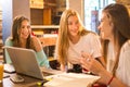 Teenage student girls talking and having fun after studying at home. Royalty Free Stock Photo