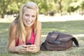 Teenage Student Texting In Park Royalty Free Stock Photo