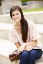 Teenage student working outdoors Royalty Free Stock Photo