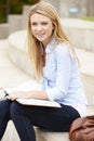 Teenage student working outdoors Royalty Free Stock Photo