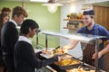 Teenage Students Being Served Meal In School Canteen Royalty Free Stock Photo