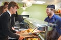 Teenage Students Being Served Meal In School Canteen Royalty Free Stock Photo